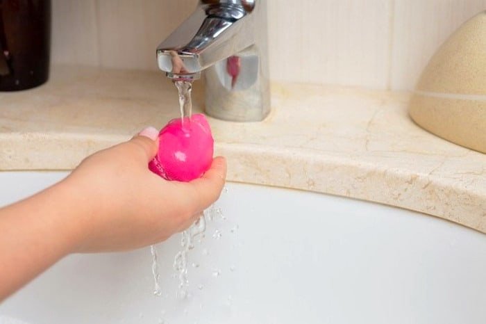Washing beauty blenders.
