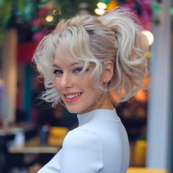 Short curly hairstyle with an open ponytail Ponytail curly hairstyle