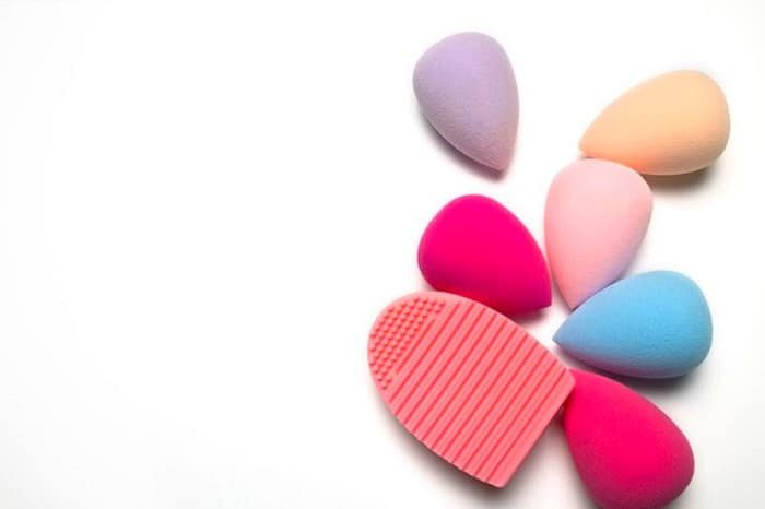 Washing makeup sponges.